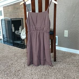 Brown dress with semi open back design.